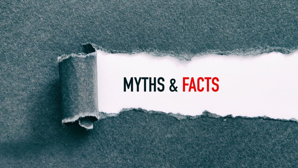 Torn paper revealing the words "MYTHS & FACTS" represents uncovering the truth about smoking myths.